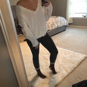 Distressed white sweater